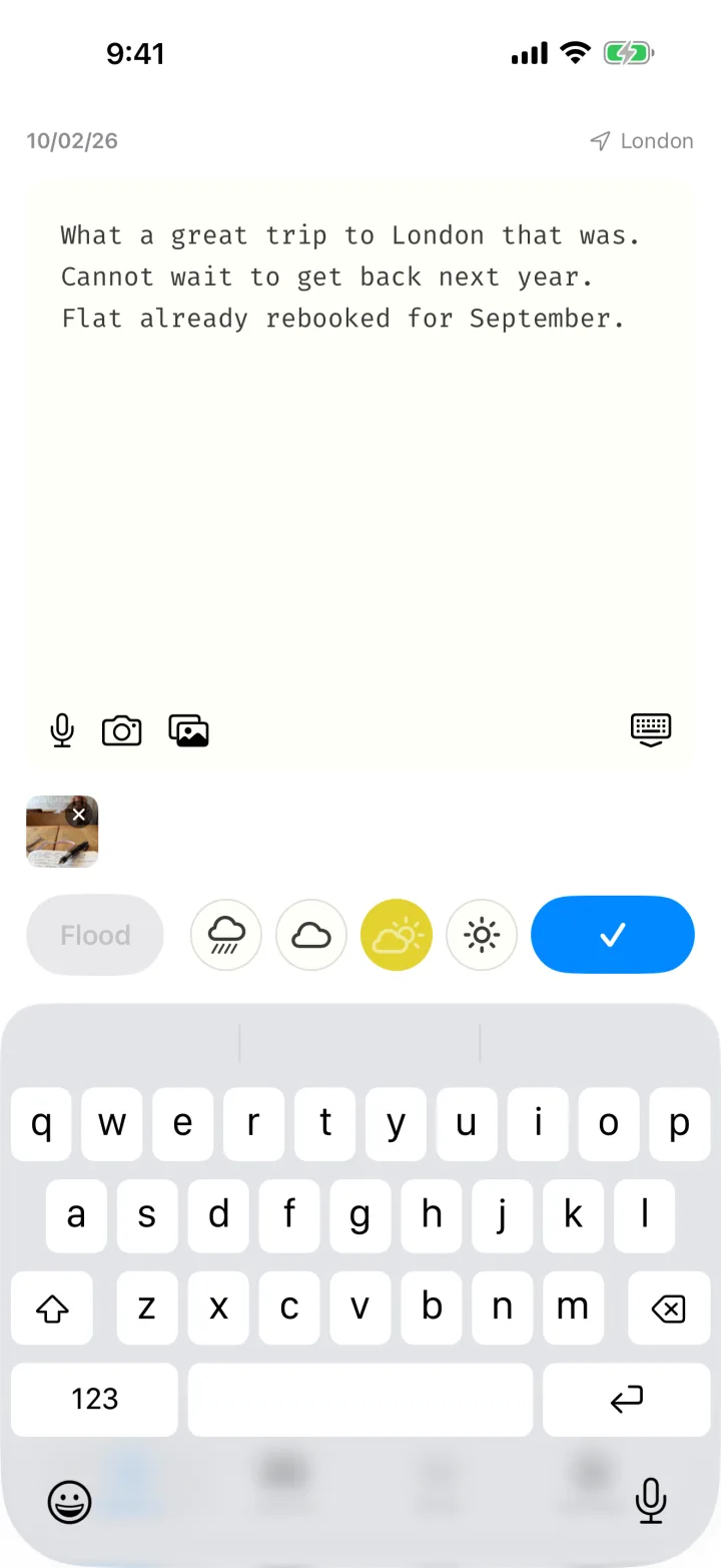 The capture screen with the keyboard up, a line half written, a photo attached and a mood picked.